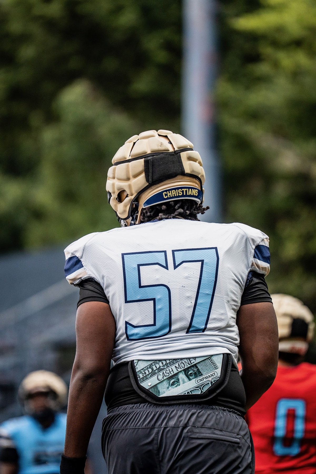 Kayden Hamilton number 57 from behind at practice